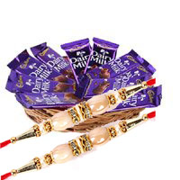 Gift Delivery in Delhi. 12 Dairy Milk Chocolate Basket With 1 Red Rose Bud to Delhi