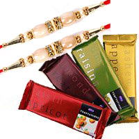 Deliver Rakhi Gifts in Delhi. 4 Cadbury Temptation Chocolates With 3 Red Roses in Delhi